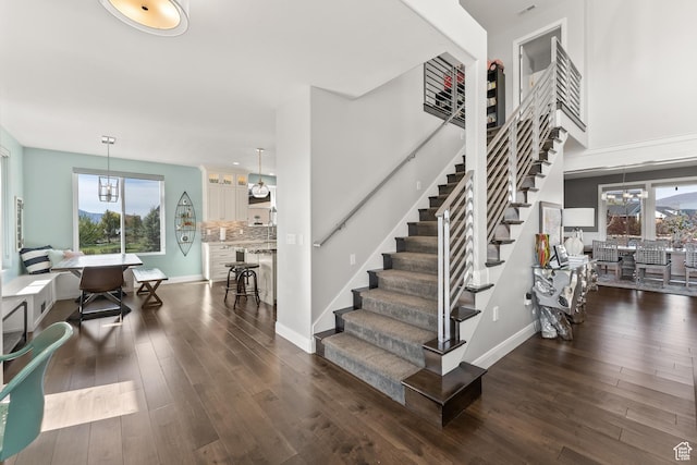 2154 E 1340 S, Heber City, UT 84032 - stairway with a chandelier, wood finished floors, baseboards, and a healthy amount of sunlight