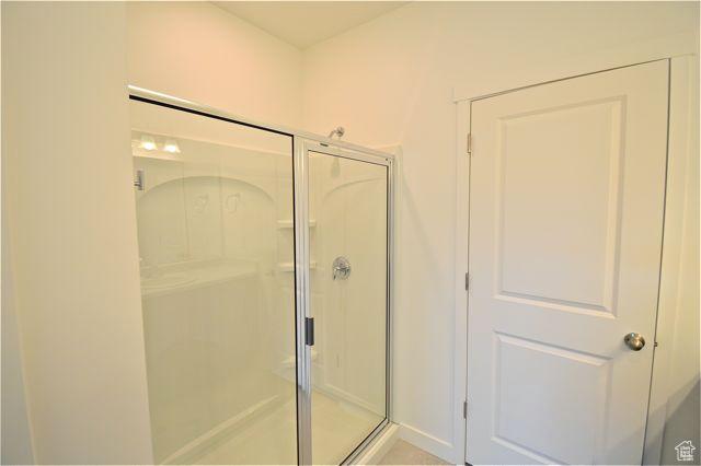 bathroom with a shower stall
