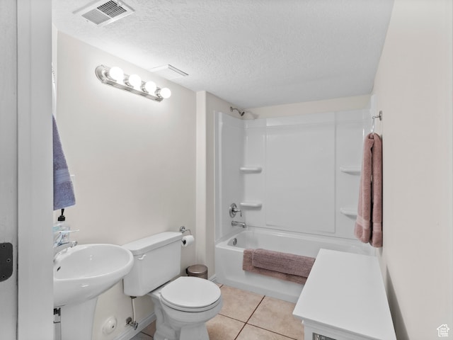 full bath with tile patterned floors, a textured ceiling, toilet, visible vents, and tub / shower combination