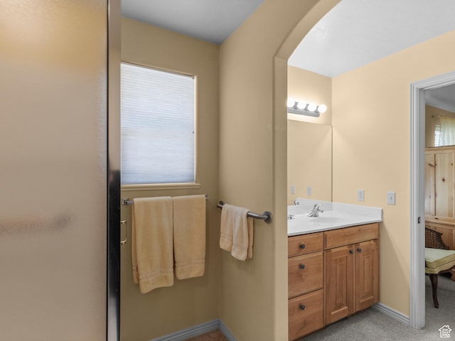 bathroom featuring vanity and baseboards
