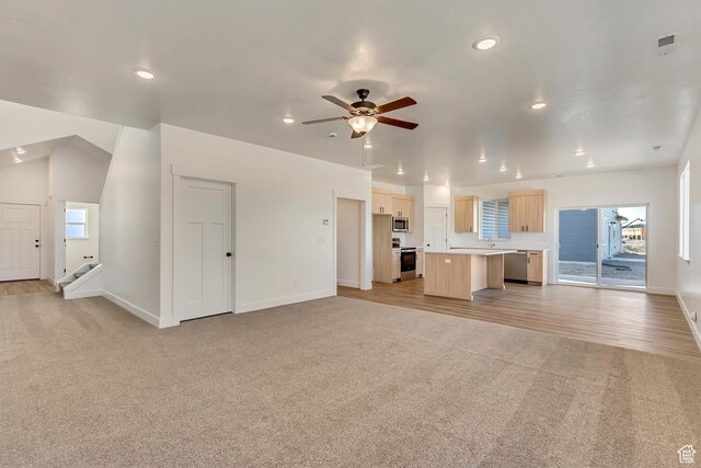 1162 W 3410 S, Nibley, UT 84321 - unfurnished living room featuring light carpet, recessed lighting, baseboards, and ceiling fan