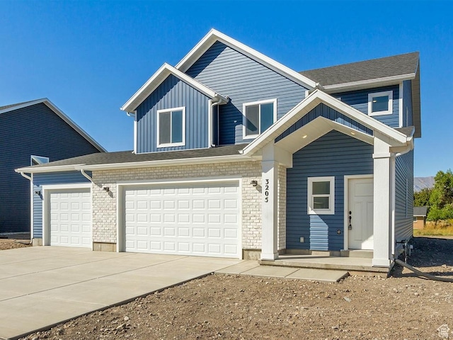 traditional-style home featuring board and batten siding and driveway