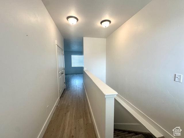 122 W 930 S, Tremonton, UT 84337 - hallway with an upstairs landing, baseboards, and wood finished floors