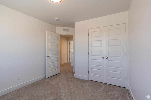 1038 W 2260 S Unit 105, Nibley, UT 84321 - unfurnished bedroom featuring carpet floors and a closet