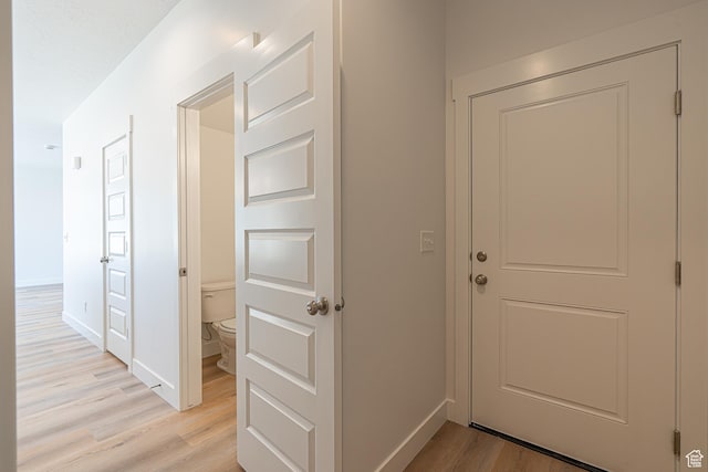 1038 W 2260 S Unit 105, Nibley, UT 84321 - hallway with light wood-style floors and baseboards