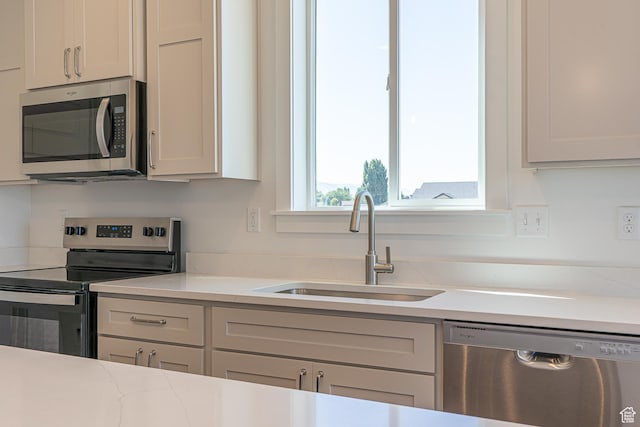 1038 W 2260 S Unit 105, Nibley, UT 84321 - kitchen featuring stainless steel appliances and light countertops
