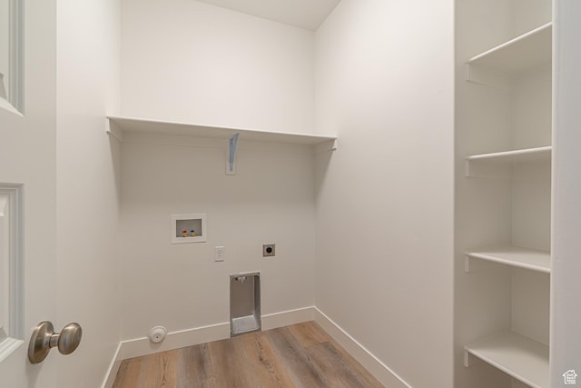1038 W 2260 S Unit 105, Nibley, UT 84321 - laundry room featuring hookup for a washing machine, wood finished floors, and hookup for an electric dryer