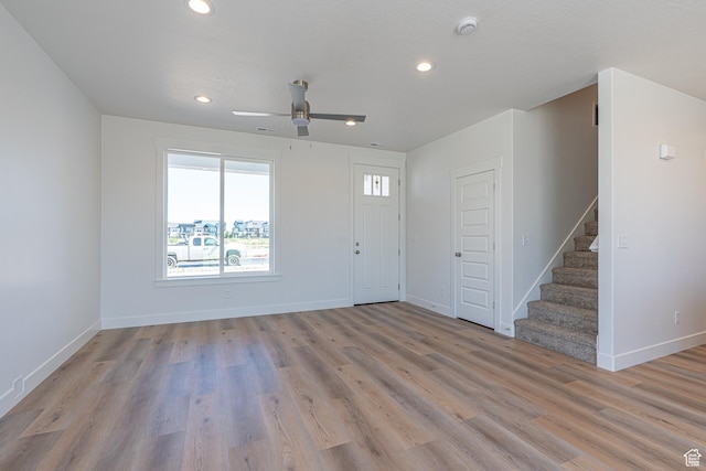 1038 W 2260 S Unit 105, Nibley, UT 84321 - foyer entrance with light wood-type flooring, stairway, a ceiling fan, and recessed lighting