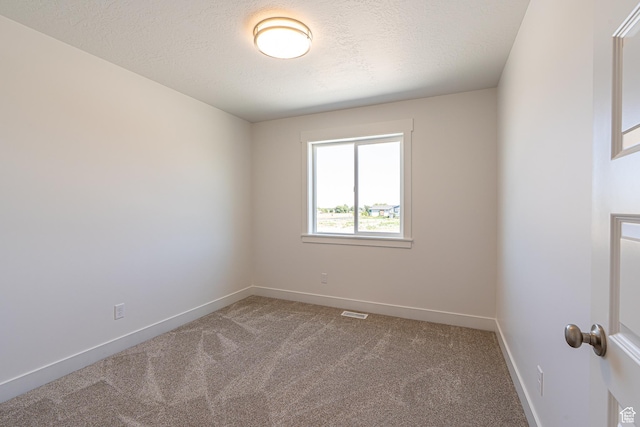 1038 W 2260 S Unit 105, Nibley, UT 84321 - empty room with carpet and a textured ceiling