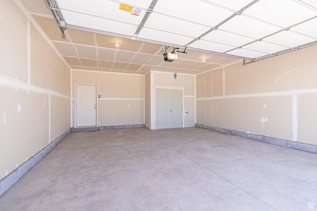 1038 W 2260 S Unit 105, Nibley, UT 84321 - garage featuring a garage door opener