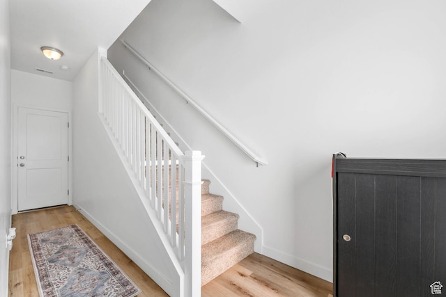 25 E Center Unit 10, North Salt Lake, UT 84054 - staircase with wood finished floors, baseboards, and visible vents