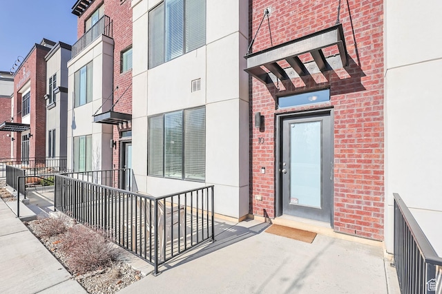 25 E Center Unit 10, North Salt Lake, UT 84054 - property entrance featuring brick siding
