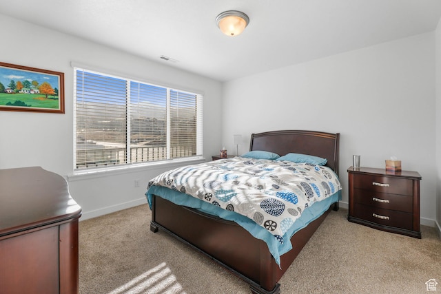 25 E Center Unit 10, North Salt Lake, UT 84054 - carpeted bedroom featuring visible vents and baseboards