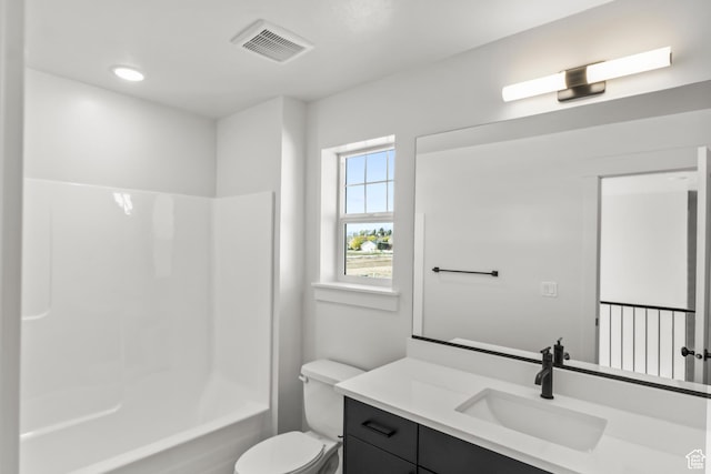 bathroom featuring visible vents, toilet, shower / washtub combination, and vanity