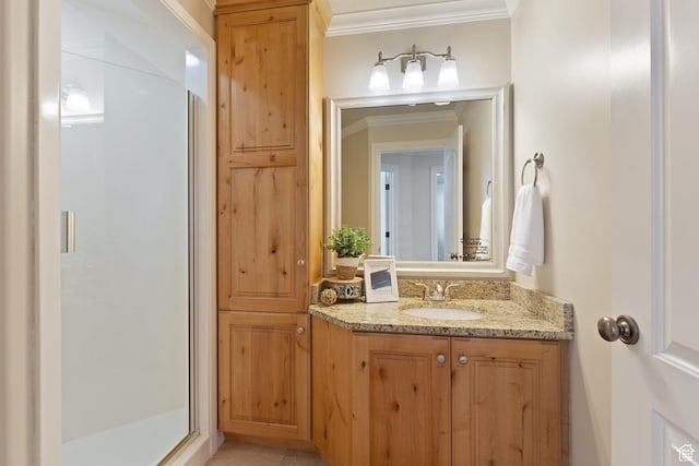 bathroom featuring a shower stall, ornamental molding, and vanity