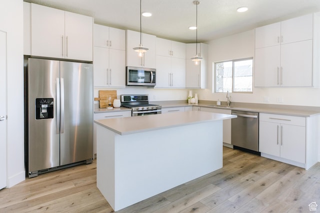 174 W Autumn Ln N Unit 138, Saratoga Springs, UT 84045 - kitchen with stainless steel appliances, recessed lighting, light wood finished floors, and a sink