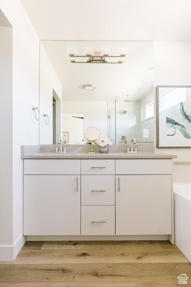 174 W Autumn Ln N Unit 138, Saratoga Springs, UT 84045 - full bathroom with a sink, double vanity, and wood finished floors