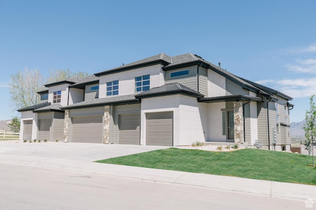 174 W Autumn Ln N Unit 138, Saratoga Springs, UT 84045 - prairie-style house featuring concrete driveway, a front lawn, stone siding, and an attached garage