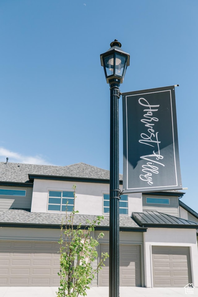 174 W Autumn Ln N Unit 138, Saratoga Springs, UT 84045 - details with roof with shingles, a standing seam roof, driveway, and metal roof