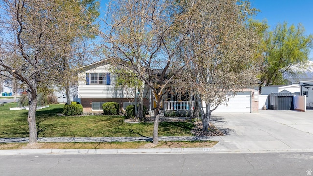 1480 W 650 S, Lehi, UT 84043 - tri-level home featuring concrete driveway, a front yard, covered porch, and a garage