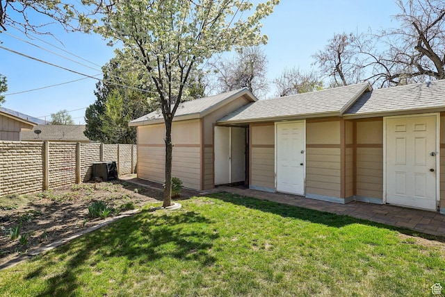view of outdoor structure with a fenced backyard