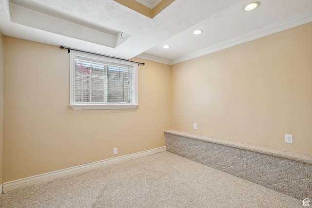carpeted empty room with recessed lighting, baseboards, and crown molding