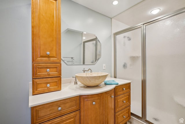 full bathroom featuring recessed lighting, a stall shower, and vanity