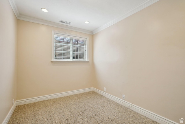 unfurnished room with visible vents, baseboards, crown molding, and carpet floors