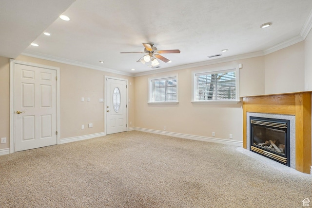 unfurnished living room with ceiling fan, carpet, a glass covered fireplace, visible vents, and recessed lighting