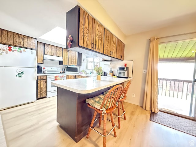 24 S 400 W, Kaysville, UT 84037 - kitchen featuring light wood finished floors, brown cabinets, range hood, and white appliances