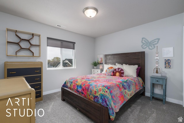 carpeted bedroom featuring visible vents and baseboards