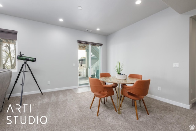 carpeted dining room featuring a healthy amount of sunlight, baseboards, and recessed lighting