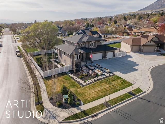 drone / aerial view with a mountain view and a residential view