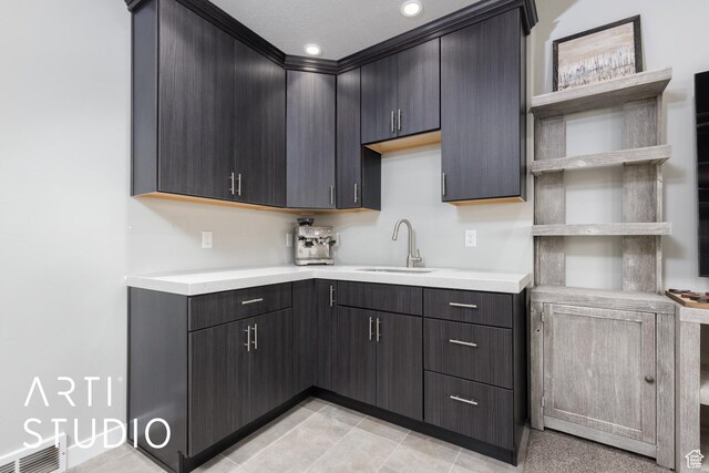 kitchen with visible vents, open shelves, a sink, light countertops, and recessed lighting