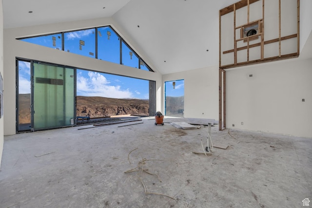 4307 E Escalante Ln, Kamas, UT 84036 - unfurnished living room featuring plenty of natural light, high vaulted ceiling, and a mountain view