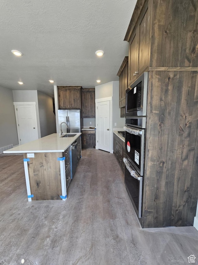 1628 S 3170 E, Spanish Fork, UT 84660 - kitchen featuring dark wood-style flooring, visible vents, recessed lighting, and stainless steel appliances