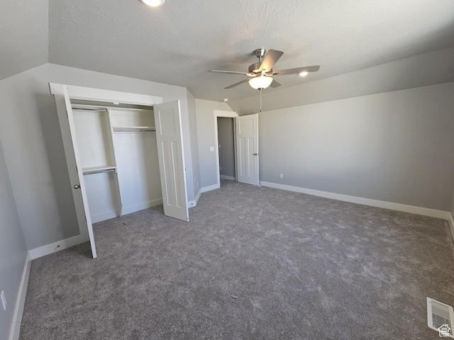 1628 S 3170 E, Spanish Fork, UT 84660 - unfurnished bedroom featuring visible vents, a closet, a textured ceiling, carpet floors, and vaulted ceiling