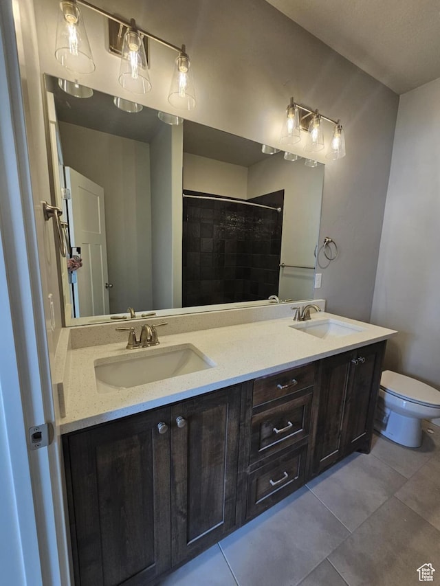 1628 S 3170 E, Spanish Fork, UT 84660 - full bathroom with toilet, double vanity, a sink, and tile patterned flooring