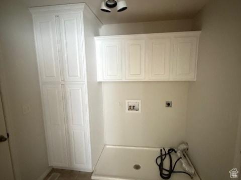 clothes washing area featuring baseboards, hookup for an electric dryer, laundry area, and hookup for a washing machine