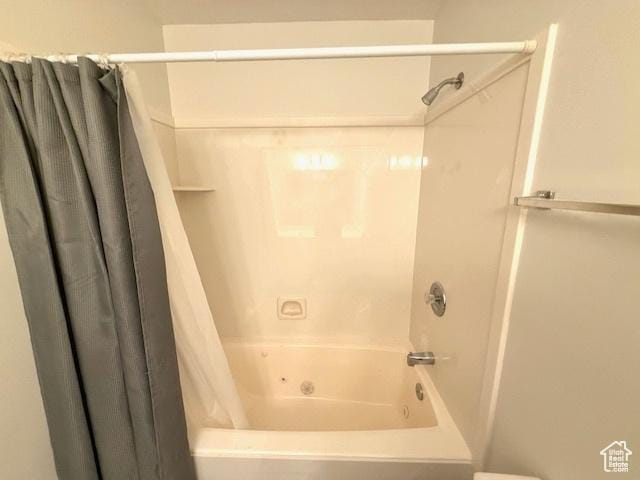 full bath featuring shower / bathtub combination with curtain