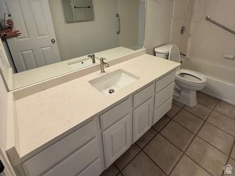 full bathroom featuring vanity, toilet, tile patterned floors, and electric panel