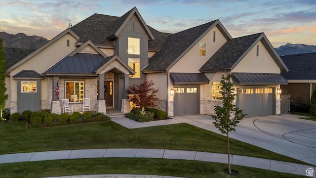 view of front of house with a standing seam roof, metal roof, and stone siding