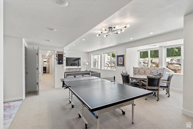 game room featuring carpet floors, baseboards, and a healthy amount of sunlight