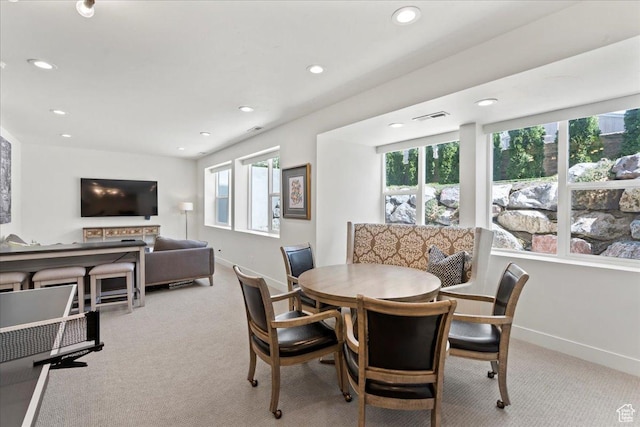 dining room featuring recessed lighting, plenty of natural light, carpet, and visible vents