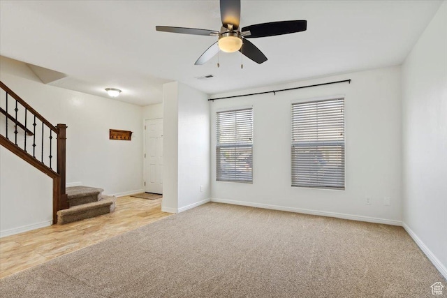 171 S Carrick Dr, Salt Lake City, UT 84115 - unfurnished room featuring visible vents, baseboards, a ceiling fan, stairs, and light colored carpet