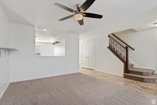 171 S Carrick Dr, Salt Lake City, UT 84115 - unfurnished living room featuring ceiling fan, stairway, carpet flooring, and baseboards