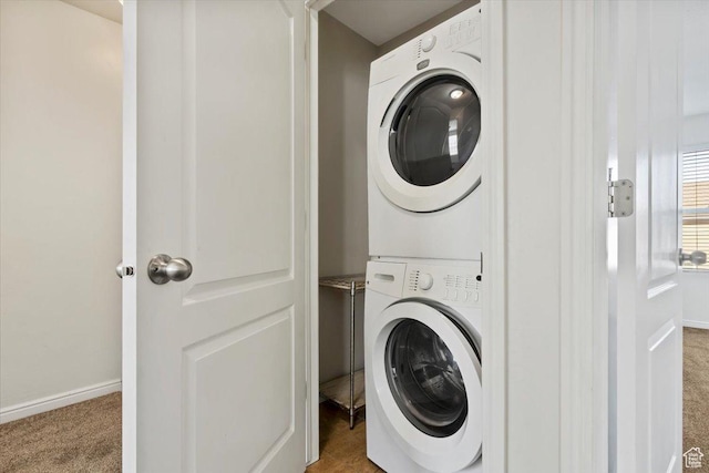 171 S Carrick Dr, Salt Lake City, UT 84115 - laundry room featuring baseboards, stacked washer and clothes dryer, carpet, and laundry area