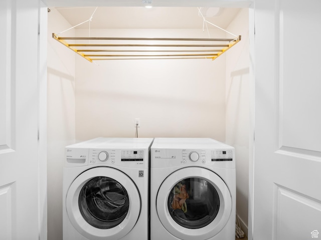washroom featuring independent washer and dryer and laundry area