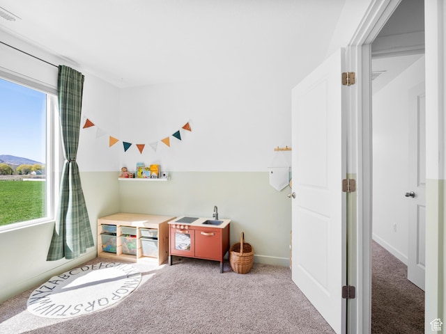 game room featuring carpet flooring, baseboards, and visible vents