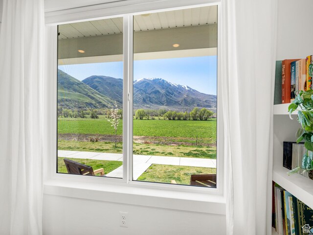 interior space featuring a rural view and a mountain view